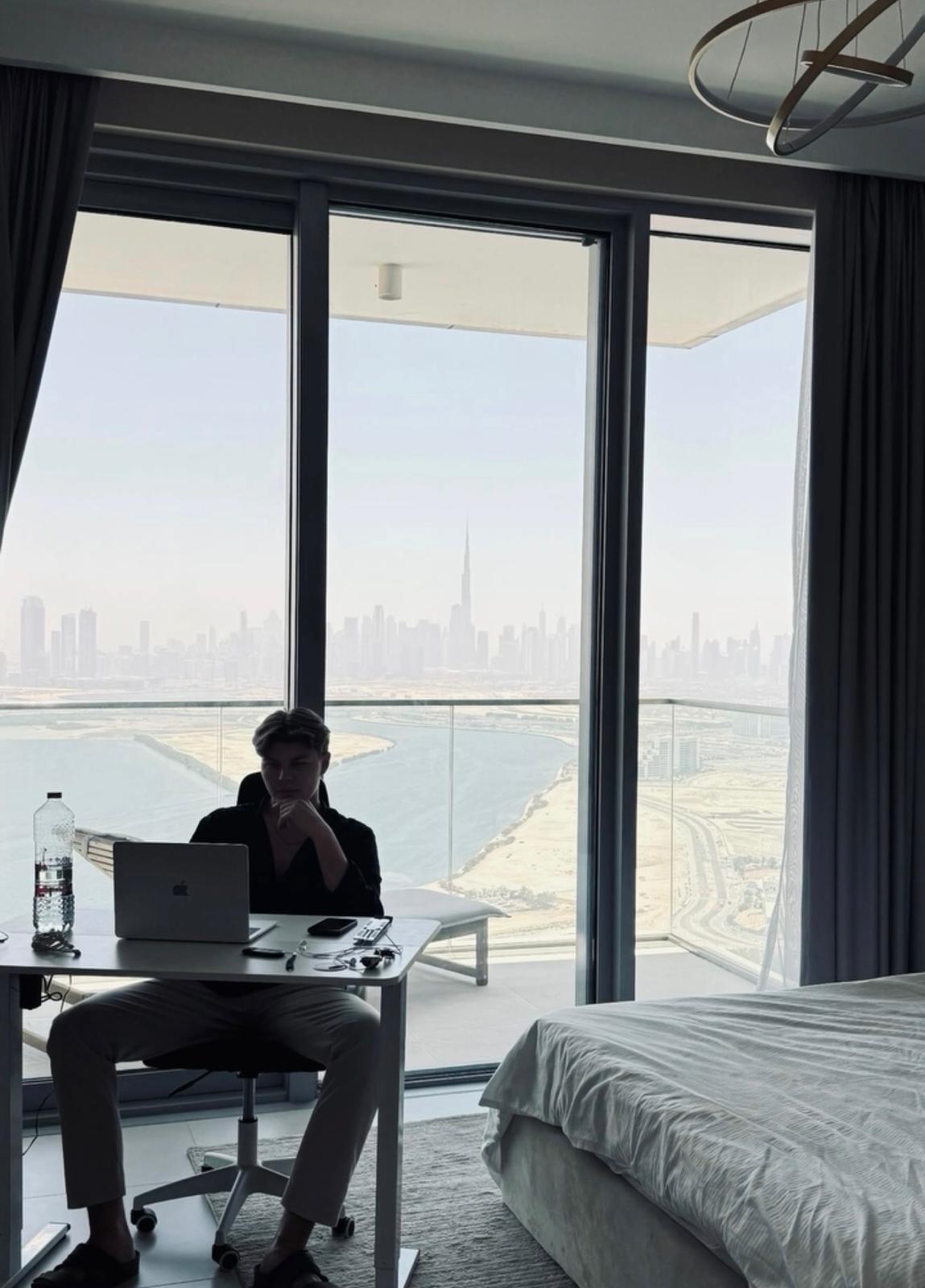 Youenn Moriceau working remotely above the Dubai skyline